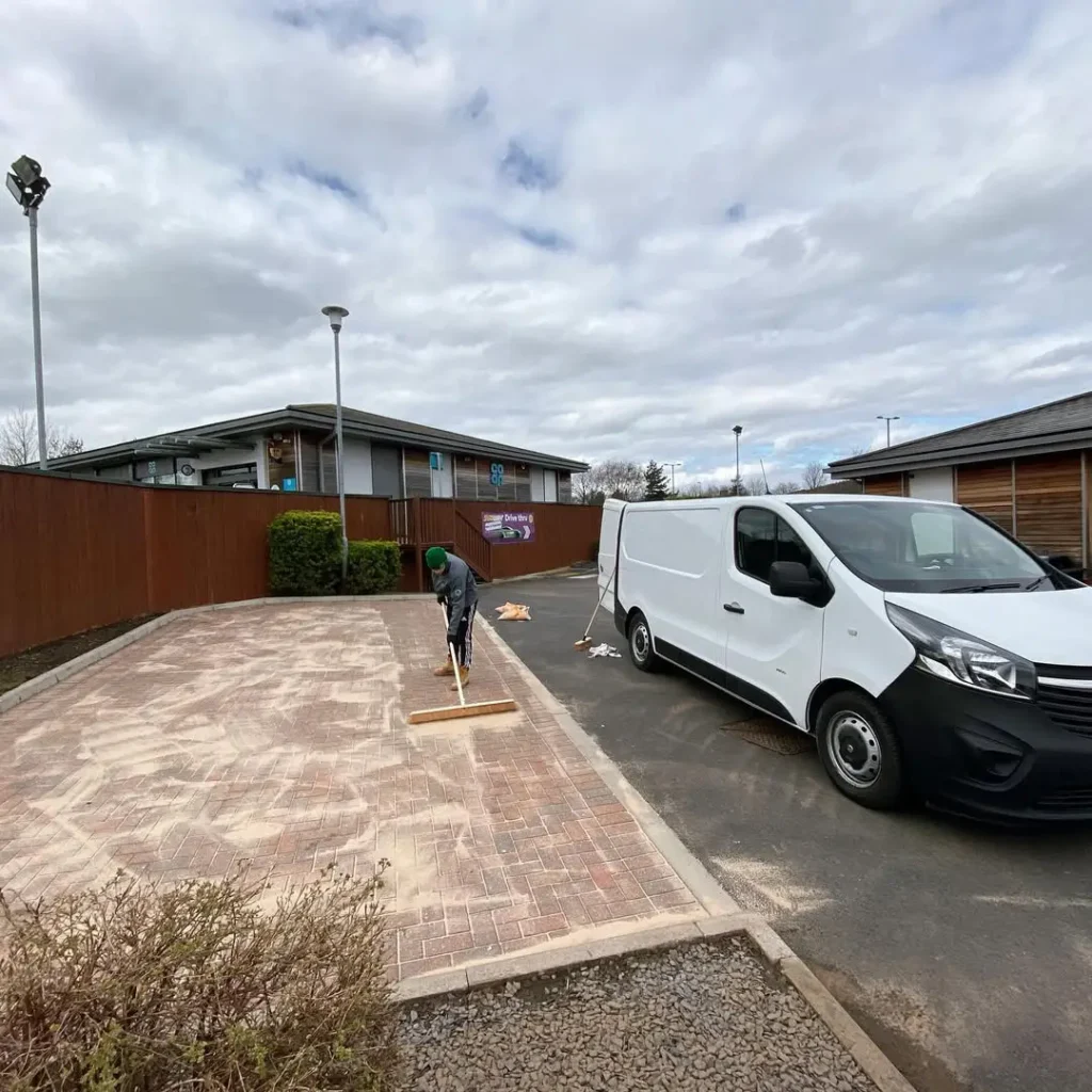 Freshly pressure-washed and re-sanded block paving outside a Subway store in Guisborough, restored by Roundhouse UK’s professional cleaning team.