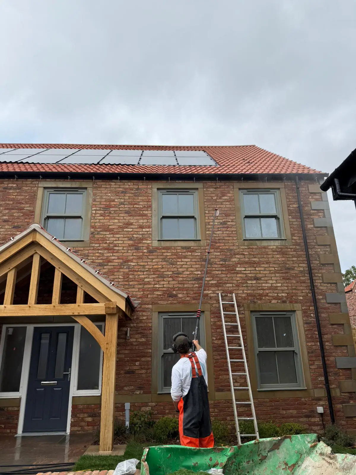 Roundhouse UK specialist cleaning the exterior of a new-build property with solar panels at Sheriff Hutton, built by Wharfedale Homes.