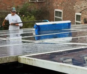 Roundhouse UK technician using the SOLA-TECS C1000 to clean solar panels with precision and efficiency.